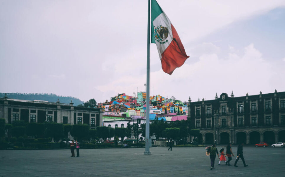 Toluca de Lerdo, Méx., Mexico. People Near Mexican Flag