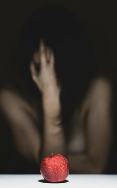 red apple and alone woman