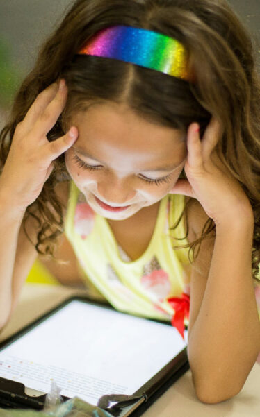 girl looking at a tablet