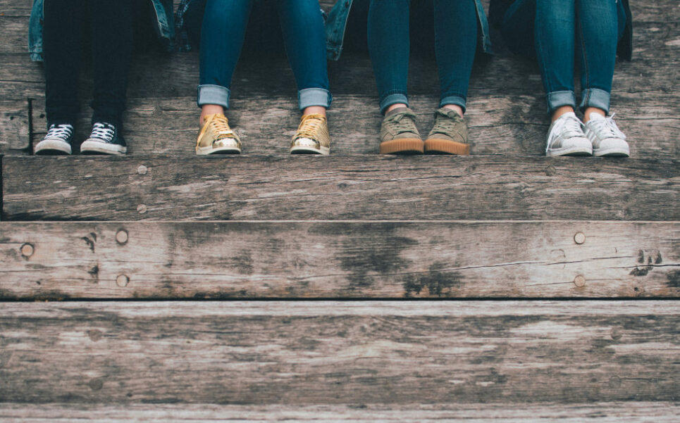teenagers sitting on steps